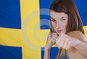 Fighting woman over sweden flag