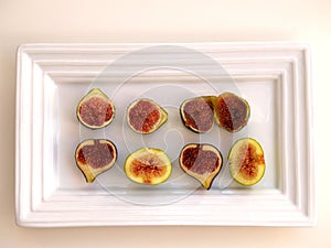 Figs cut on a white tray