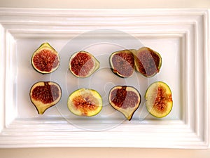 Figs cut on a white tray