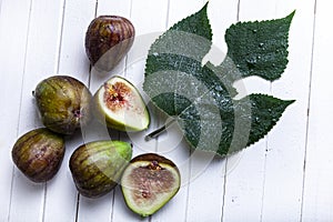 Figs and leaves on a white background