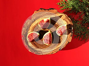 Figs with red flesh on a wooden background. Fruit on the stump