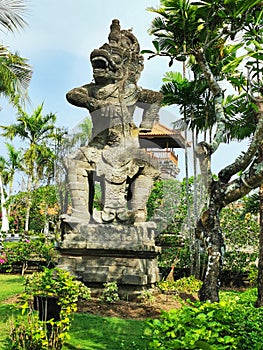 A figure of a Balinese Hindu guardian on a street on Bali Island in Indonesia