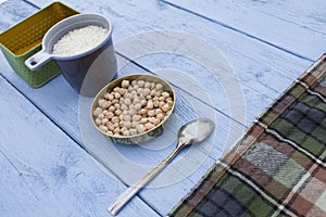 Figure chickpeas and spices on a wooden background