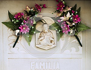 Figure of Christ on the grave with beautiful flowers part 6 photo