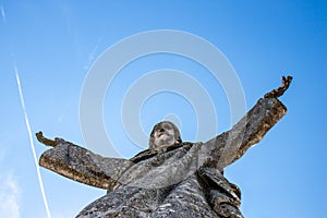 Christ the King looking over Castelo de Rodrigo, Portugal photo