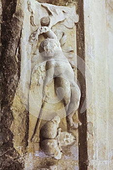 Figure and decorative motifs of religious character of the facade of a church, Spain.