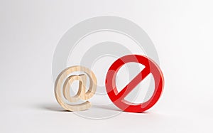 Figure of e-mail or internet and a symbol of prohibition or restriction. blocking access to the World Wide Web, self-isolation and photo