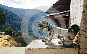 The figure of a fantastic dragon dog on the chain at the entrance to the Chagri Cheri Dorjeden Monastery, Buddhist monastery near photo