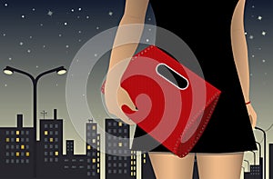 Figure of a girl in a dress with a red bag on background of the night city