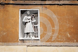 Statue of guild worker, Venice, Italy photo