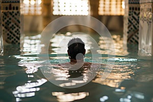 figure immersed in a traditional hammam bath