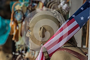figure of an Indian with an american flag detail