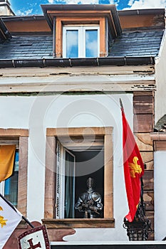 figure of a knight in the window of a building