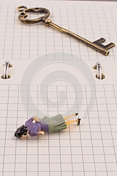 Figure near a key on a notebook