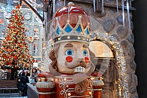 the figure of a nutcracker soldier in an old uniform in the winter city. the concept of Christmas and New Year decorations