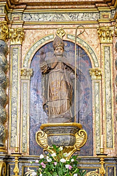 figure of Santo Amaro on the side altar inside the Igreja Matriz de Colares Nossa Senhora da AssunÃ§Ã£o photo