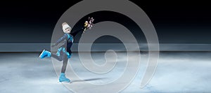 Figure skater on dark ice arena background