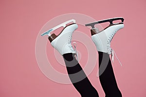 Figure skating is a winter sport and leisure. Women`s feet in ice dancing skates.