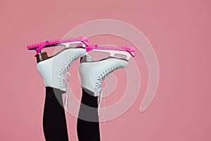 Figure skating is a winter sport and leisure. Women`s feet in ice dancing skates.