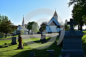 Side by side churches  from  St john the Baptist catholic cemetery in wilton wisconsin photo