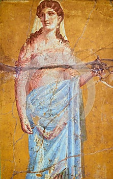 Figure of a woman painted in a Fresco in a Domus of Pompeii