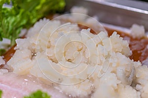 Figured carved slices of squid