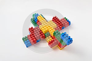 Figures from a colored cubes designer on a white background