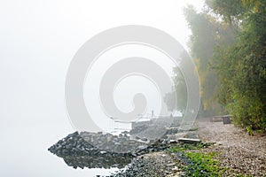 Figures of the fishermen in the fog
