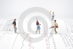 a  figures of golfers playing a golf at the open book