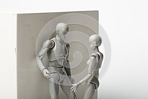 Figures of people communicate around a plaster cube