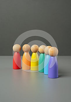 Figures of people lined up in the colors of the LGBT flag.