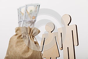Figures of people with money bag on white background. Family savings concept. Close-up