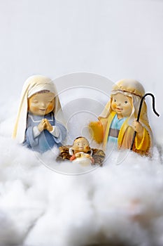 Figures of Portal de Belen on cotton simulating clouds. Christmas greeting concept. Copy Space