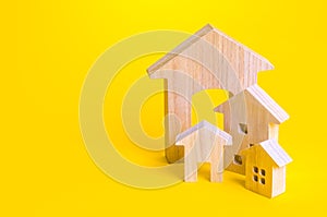 Figures of residential buildings on a yellow background. Affordable housing. Search best option apartment and real estate, rent.