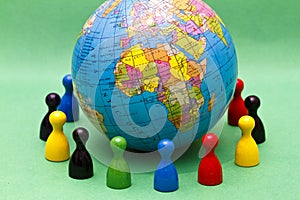 Figures surrounding globe photo