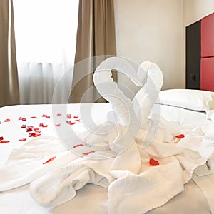 Figures of swans made of white towels in a hotel
