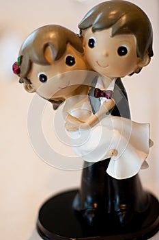 Figures from the wedding cake photo