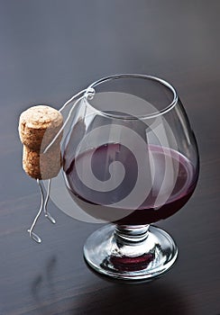 Figures from wine corks and glass of wine