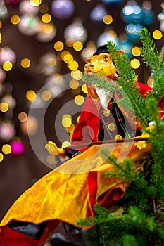 Figurine of a bull in a classic suit of an Englishman on a Christmas tree