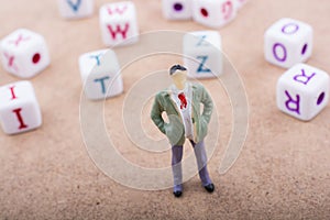 Figurine and the colorful alphabet letter cubes