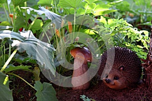 Figurine hedgehog under the mushroom