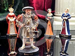 Figurine of king Henry viii on other figurines backgroun