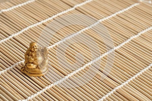 Figurine of a laughing and cheerful golden Buddha