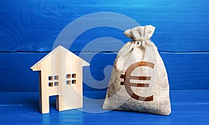 Figurine silhouette house and euro money bag. Buying and selling real estate. Taxes. Mortgage loan. Sale of housing. Proposal for