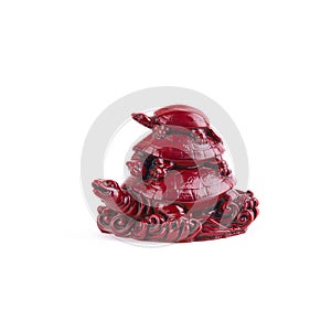 Figurine of a turtle. The concept of wealth, success, growth and prosperity. three turtles. burgundy color. isolated on