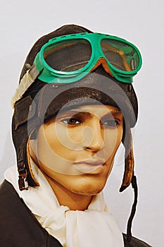 Figurine of a young man with retro leather motorcycle helmet and plastic protection goggles