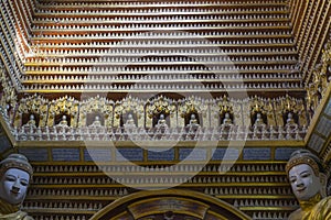 Figurines of Buddha inside the temple photo