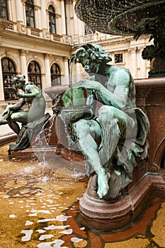 The figurines at the statue of Hygieia in Hamburg photo