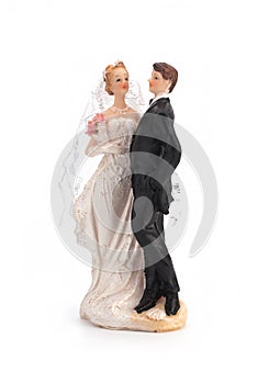 Figurines of a wedding cake on a white background