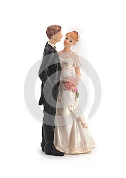 Figurines of a wedding cake on a white background